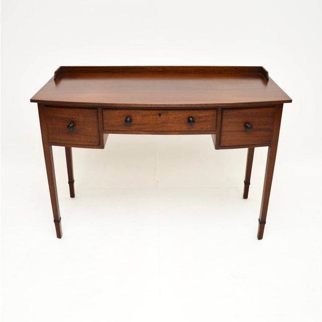 A smart and very useful antique Edwardian desk / writing table. This was made in England, it dates from around the...