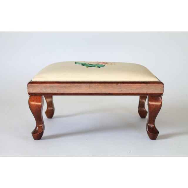 Vintage floral footstool by "The Bombay Company" with floral motif. Makers mark on bottom. Dated 1987. Made in Taiwan....