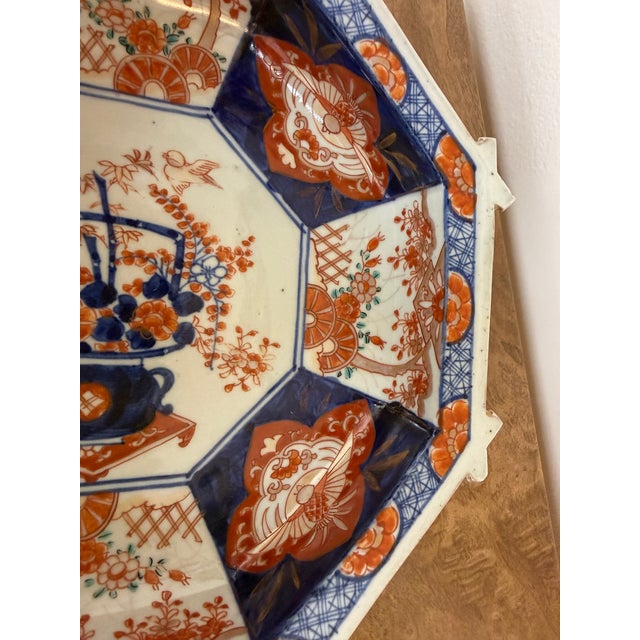 This antique Imari bowl has rare details with floral motifs and beautifully shaped octagonal lines. The glazing indicates...