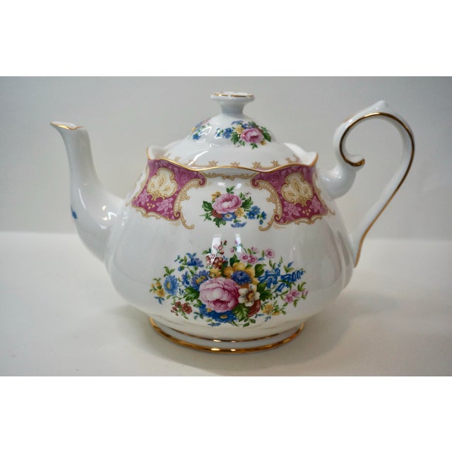 Add a touch of classic English elegance to your tea service with this stunning duo from Royal Albert in the beloved Lady...