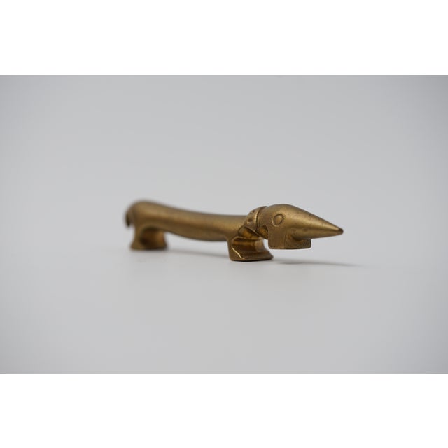 Object: Bottle opener in the shape of a dachshund Designer: Walter Bosse (1904–1979) Age: 1950s/1960s Material: Brass...