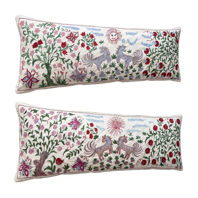 This beautiful 18'' x 52'' hand-embroidered Suzani pillow cover set was made from authentic Uzbek cotton fabric. The...