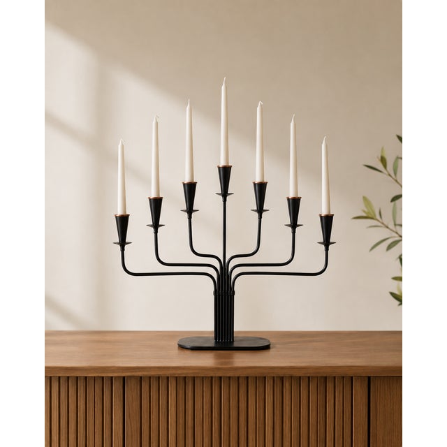 A sculptural seven-arm candelabrum attributed to gunnar ander for ystad-metall, sweden, dating from the mid-century...