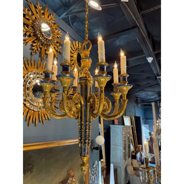 Fine French Louis XVI gilt bronze and blue enamel 8-light chandelier. A French Louis XVI chandelier is one of the most...