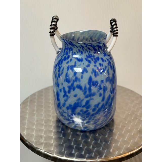 Design Plus Gallery presents a Mouth Blown Vessel Signed by Michael Fox and Dated 2000. The vessel is extraordinary and...