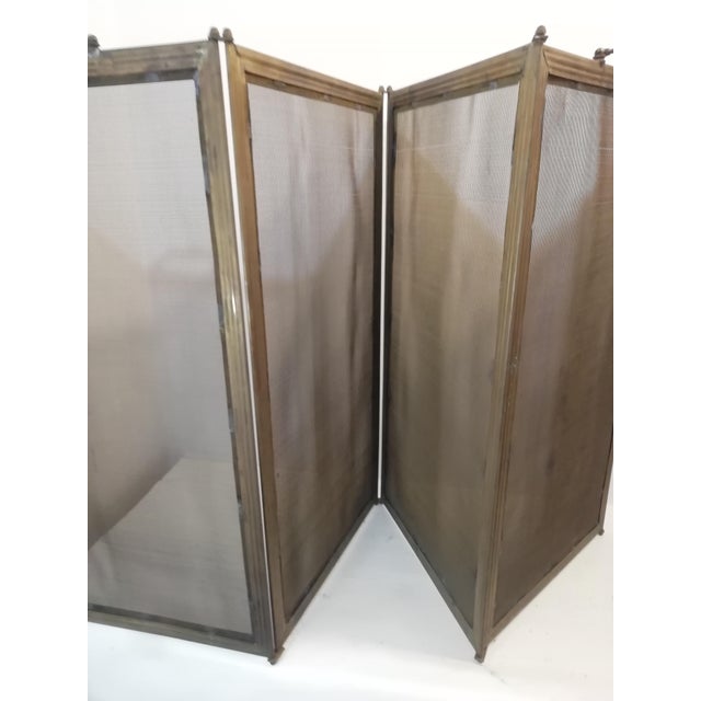 Original vintage fire screen made entirely of brass. Large format with four doors. Good overall condition. Complete with...