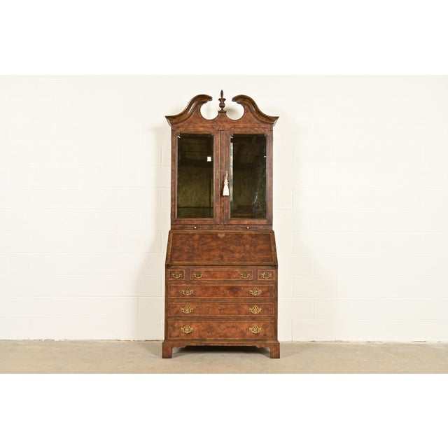 An outstanding Georgian or Chippendale style bureau with drop front secretary desk and bookcase hutch top By Baker...