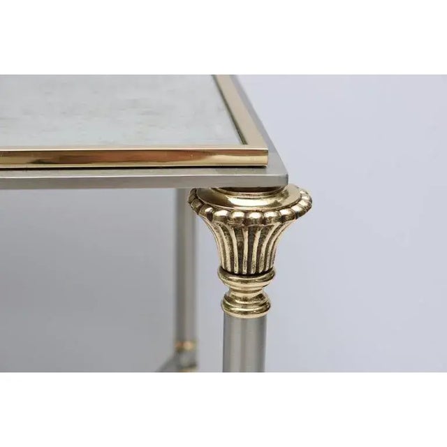 This stylish side table with its Louis XVI lines is very much in the style of pieces created by Maison Jansen. The...