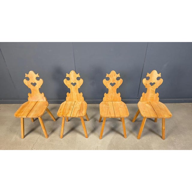Vintage oak heart shaped dining chairs in tiroler style. These rustic chairs where nicely handcrafted. Sturdy frames....