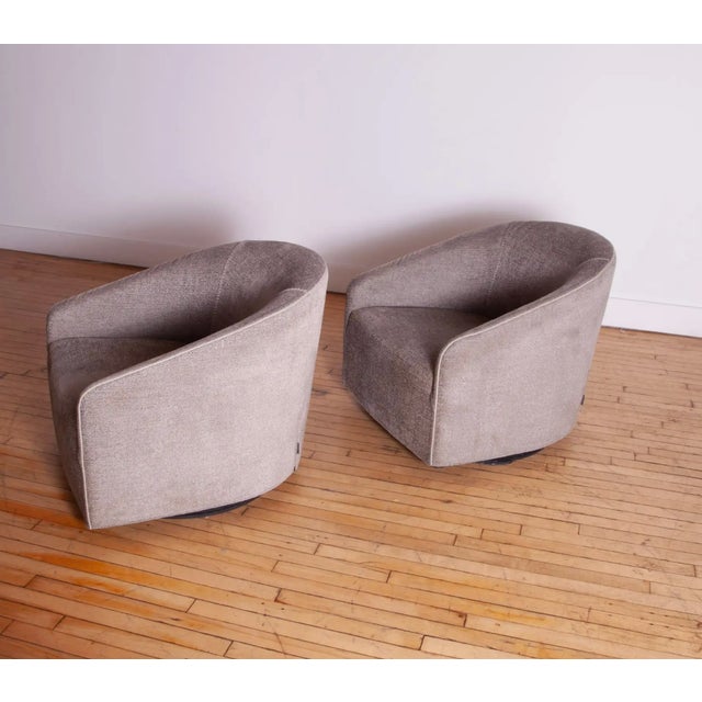 We are pleased to present a pair of Minotti Portofino Swivel Lounge Chairs, designed by the acclaimed Rudolfo Dordoni. A...