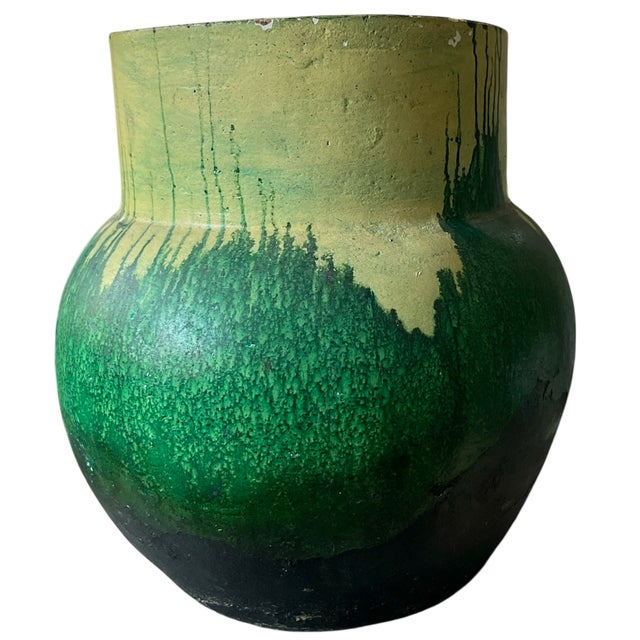 A bold and sculptural 1970s earthenware vase featuring hand-applied green drip decoration over a warm chartreuse ground....