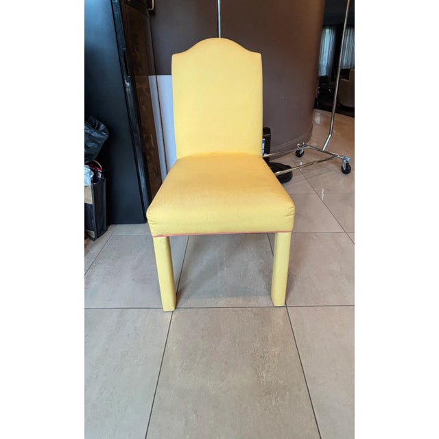 Set of 4 The Charles Stewart Company Upholstered Parsons Dining Chairs. Yellow with salmon piping trim. Very comfortable.