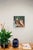 Mirrored Touch captures a moment of introspection, with a figure gently holding their hands together in a soft,...