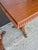 Handsome pair of 19th Century Anglo Indian tables crafted in mahogany having carved edges on top set on turned pedestals...