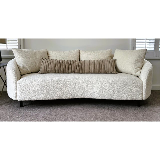 Luxurious Curved Bouclé Sofa – Mint Condition Elevate your space with this stunning curved sofa, a true statement piece in...