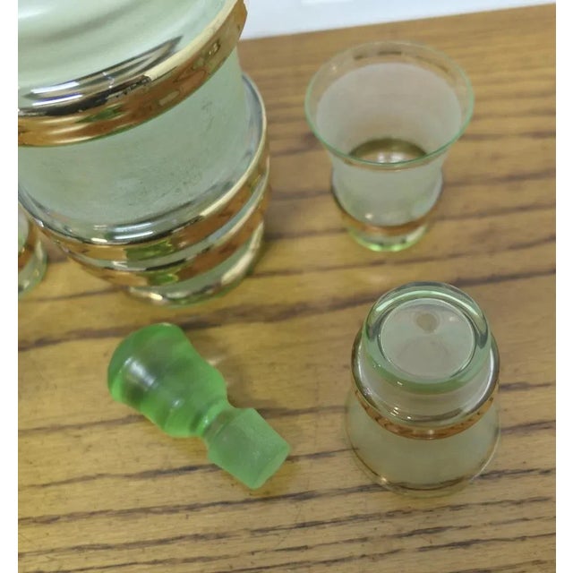 Retro Green and Gold Glass Sherry Decanter and 4 Glasses Undoubtedly Retro chic, a beautiful Green and Gold Sherry...