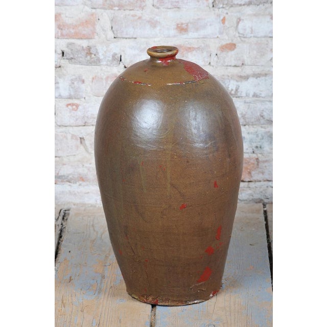 This ceramic vase originates from early 20th-century Czechoslovakia and stylistically bears elements of Art Deco...