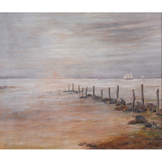 A Danish tonalist seascape in oil on canvas, circa 1910. A row of weathered pilings marches out into calm water, leading...