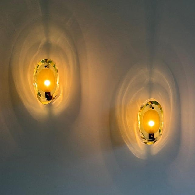 A superb pair of original model 2093 wall lights designed by max ingrand for fontana arte in the 1960s — with two...