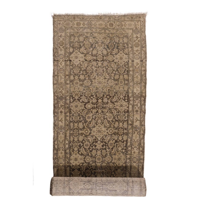 A lovely hand knotted circa 1900 antique Malayer runner in light colors.This rug has an Abrash which is a natural change...