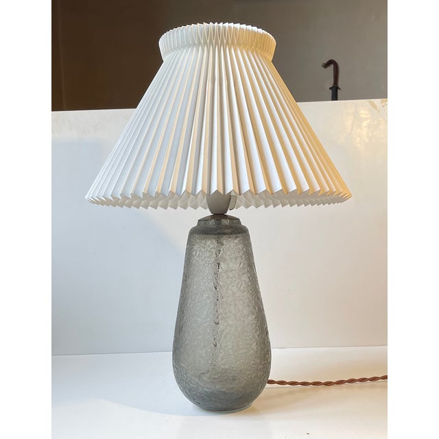 A gourd shaped table lamp in tumbled thick and heavy grey smoke art glass. It is called ice flower (danish isblomst) and...