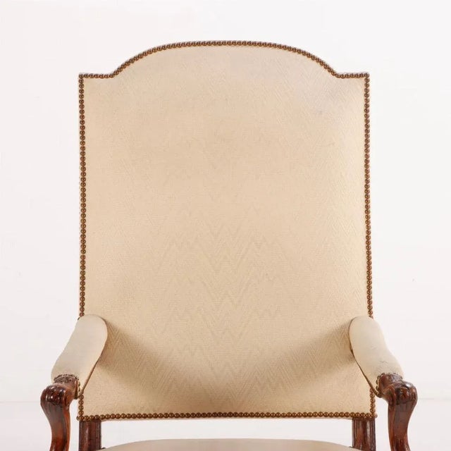 Large scale French walnut open arm chairs with hooved feet C 1900.