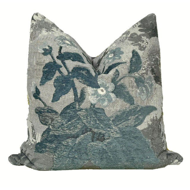 This heavy woven upholstery fabric is beautifully embroidered in tones of gray, green, deep teal light blue, and ivory,...