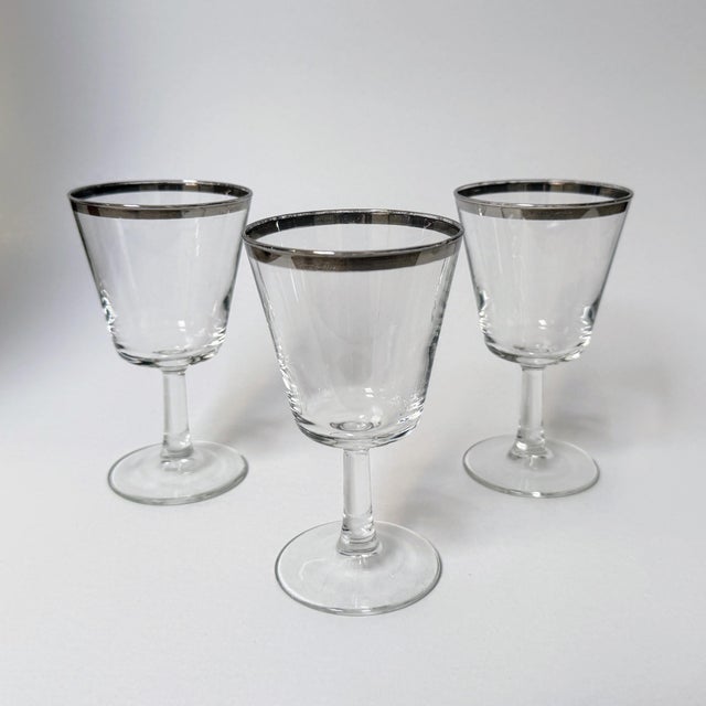 This gorgeous trio of vintage wine glasses are hand-blown vintage French pieces made by Cristal d’Arques-Durand in the...