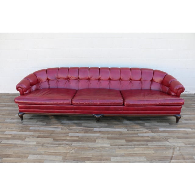 Striking Mid-Century Modern three-seat leather sofa by Monteverdi-Young Inc., Los Angeles, dated February 1973....