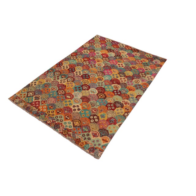 A mesmerizing addition to any decor, this exhilarating hand-knotted rug featuring exquisite coloration in an intricate...