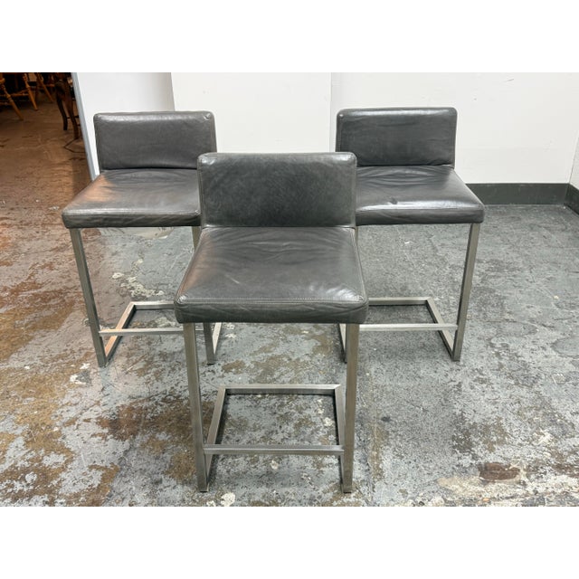Design Plus Gallery presents a Set of Three Modern Lira Counter Stools from Room & Board. The stools are highly rated,...