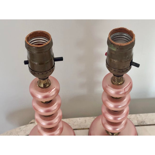 Small pair of pink and brass boudoir accent lamps, uniquely shaped and beautifully made. The perfect pink accent for...