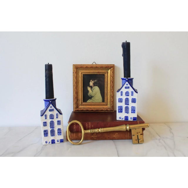Pair of vintage blue and white ceramic house candle holders. Made in Korea. Minor age wear. No chips.