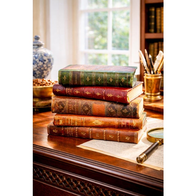 This handsome set of five antique leather-spine books embodies the quiet elegance and scholarly charm of the 19th century....