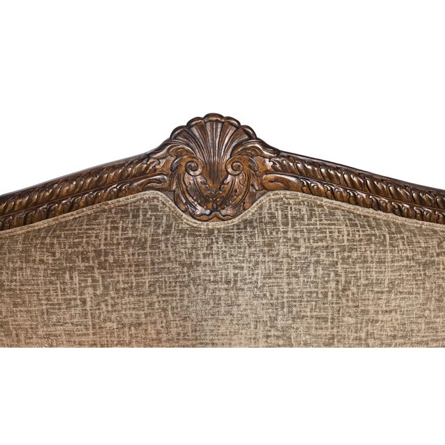 Striking vintage Bassett sofa, item no. 7361-62, dating to circa 1996. Features an elaborately carved exposed wood frame,...