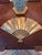 This vintage brass fan-form plaque features a detailed relief of the Fenghuang, the Chinese Phoenix, surrounded by...