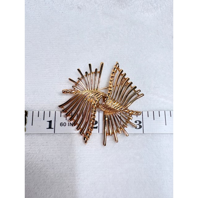 Designed during Marcel Boucher’s celebrated early 1950s sculptural metalwork period, this vintage brooch (design 379R)...