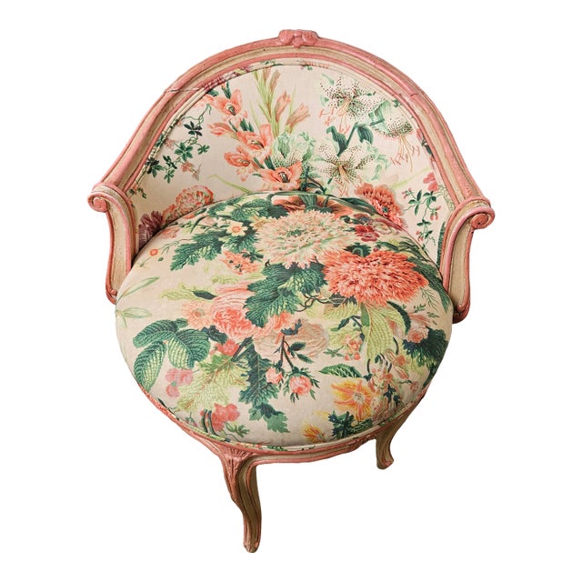 Vintage French Style Vanity Swivel Chair With Chintz Upholstery and Painted Coral and Ivory Frame For Sale