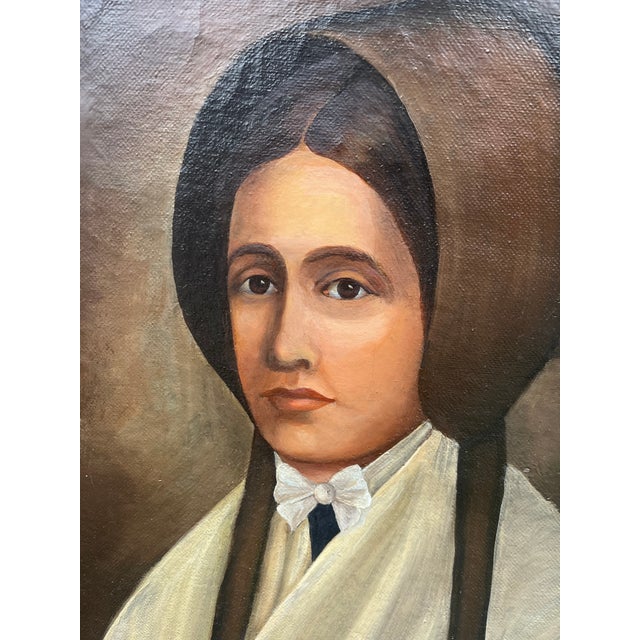 Striking 1920s folk art portrait of a young woman from the 1840s. She’s wearing a brown bonnet of the mid nineteenth...