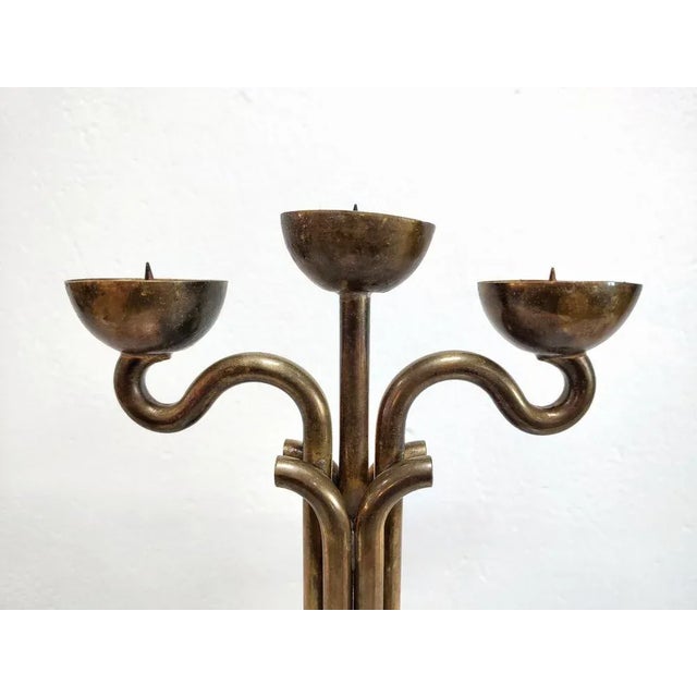 In this listing you will find a rare Brutalist three-arm candlestick holder done in bronze and chrome. It features...