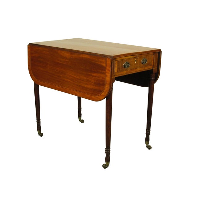 An early 19th-C. English George III inlaid mahogany pembroke table with extensive satinwood banding and ebony strinig...