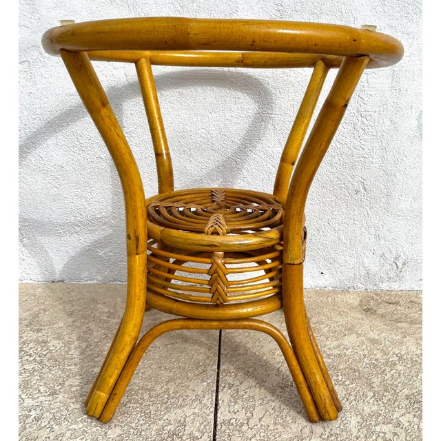 Offered is a stunning pair of Paul Frankl style spiral pencil reed and bamboo side tables. Acquired from an estate sale in...