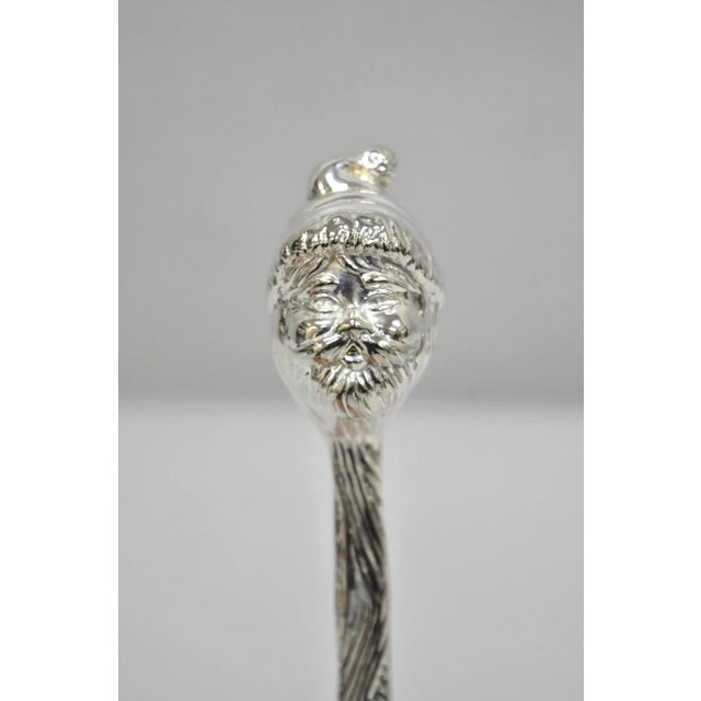 Vintage 9" Santa Claus Christmas Silver Plated Candle Snuffer by Head. Circa Late 20th Century. Measurements: 1" H x 9.5"...