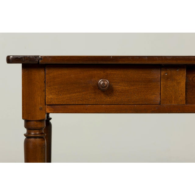 Handsome mid-19th century French Louis Philippe walnut writing table or desk, sourced in Provence, France. The rectangular...