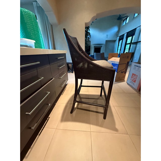 Attributed to Barbara Barry for McGuire espresso caned barstools with cushions. Four available. See photos for scratches...