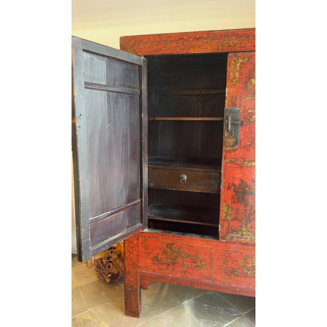 Beautiful Antique Chinese Chinoiserie style wedding cabinet from Shanxi Province, China. hand-lacquered in rich red with...