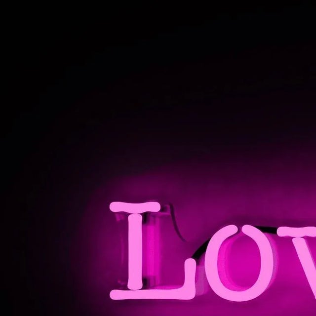 This neon piece is hand blown glass. It is mounted on contoured, clear plexiglas with pre drilled holes for hanging, and...