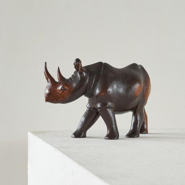 This is a wonderful rhino sculpture in solid carved wood, Europe, 1950s. Very well made, this rhino sculpture features...