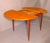 This fine dining table was made in Italy in the 1960s. It has a circular 120 cm top and an extra leaf folded underneath....