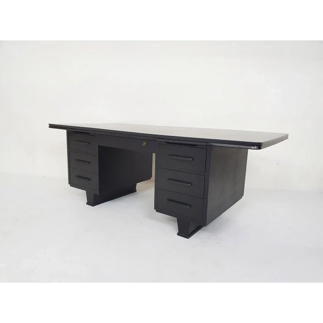 Large executive desk in black painted wood. In very good condition.